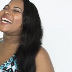 Happy young African-American woman smiling