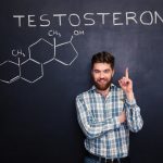 Man standing in front of chalkboard with Testosterone written
