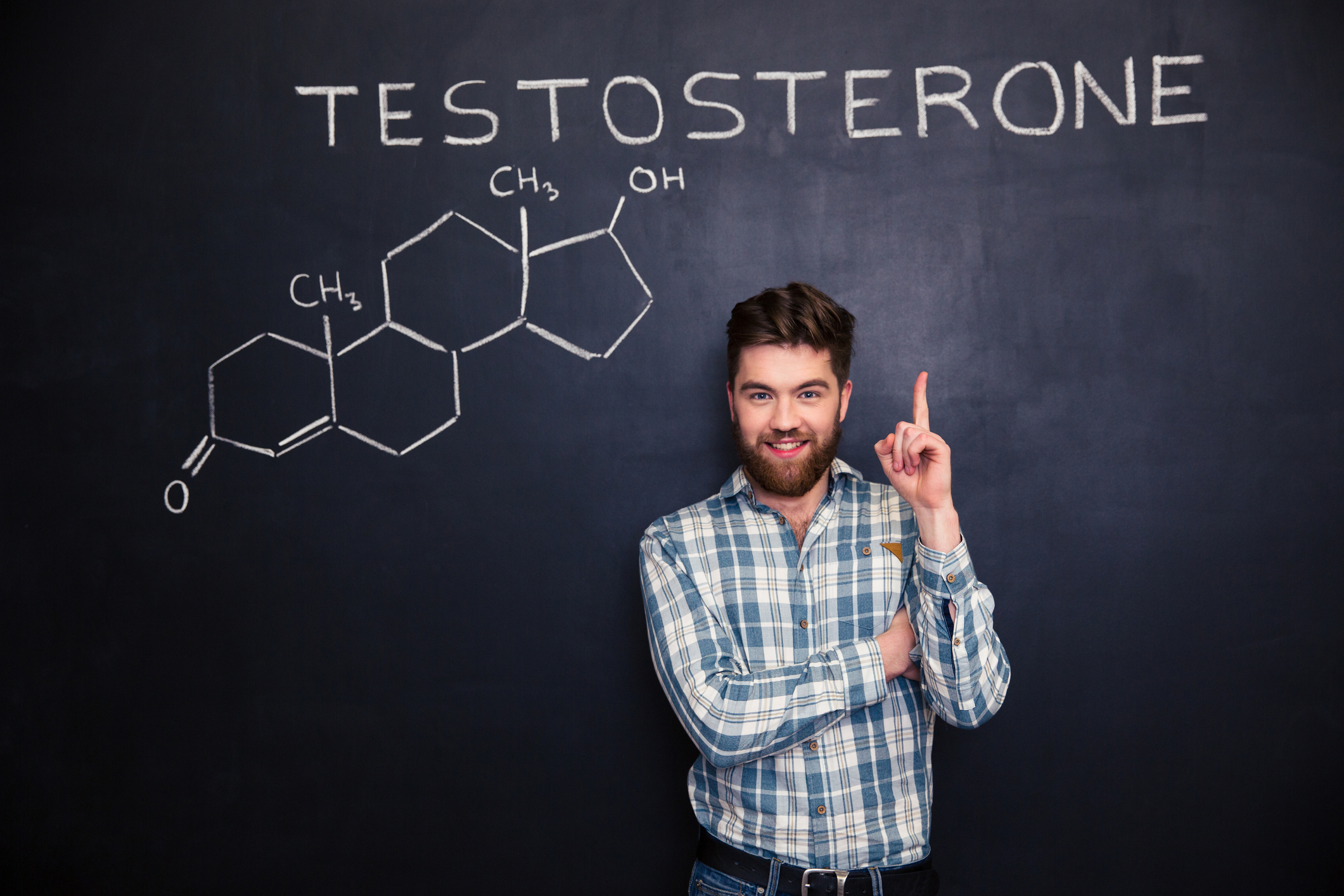 Man standing in front of chalkboard with Testosterone written