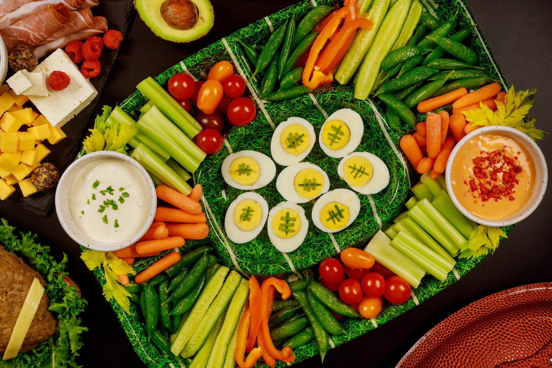 Platter of various vegetables, dips and deviled eggs