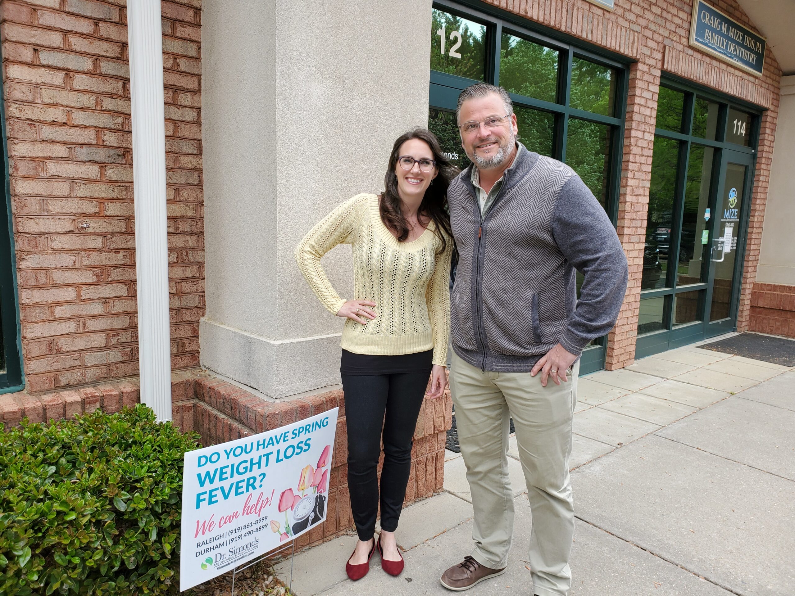 Michelle Kennedy, NP-C and Dr. Wickham Simonds standing outside of Raleigh office.