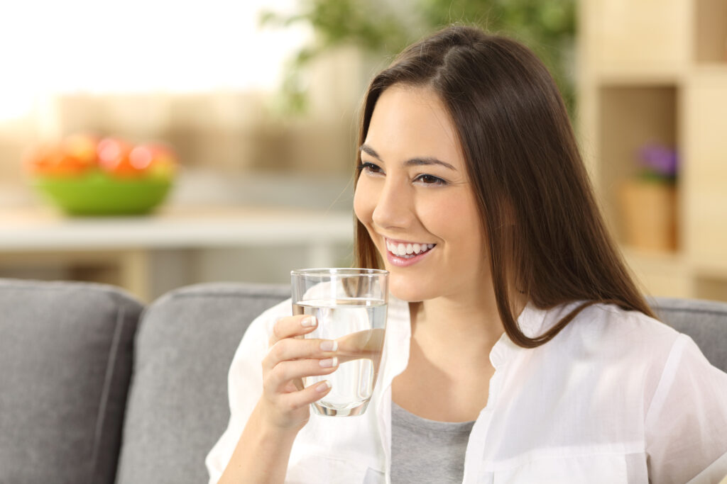 Woman drinking water from a glass