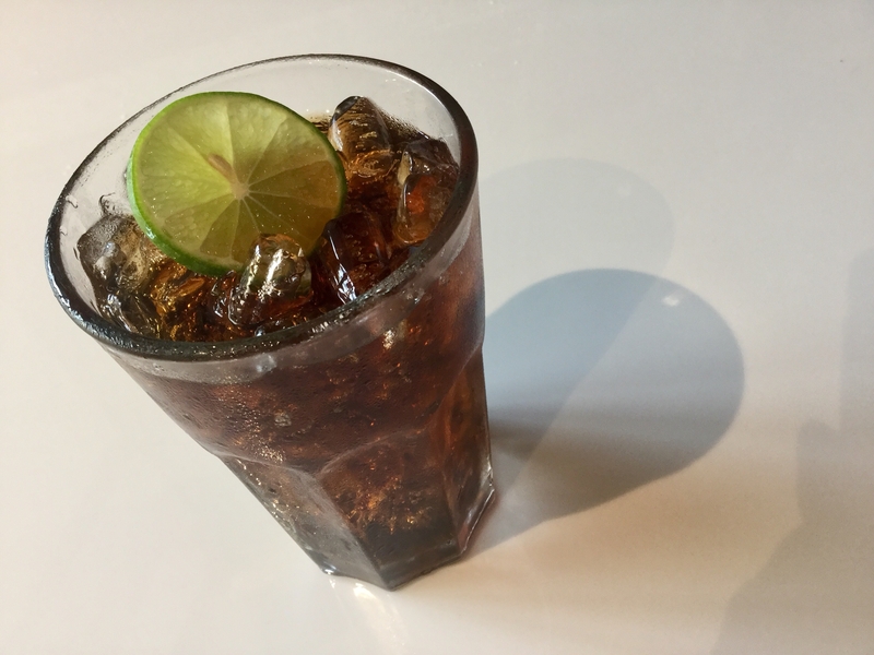 Cold glass of Diet Soda with ice and a slice of lime