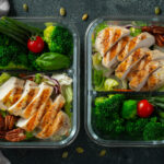 Healthy meal prep containers with green beans, chicken breast and broccoli